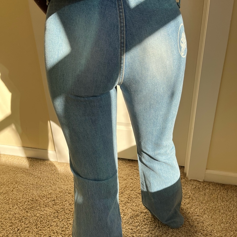 low to mid rise medium wash flare jeans